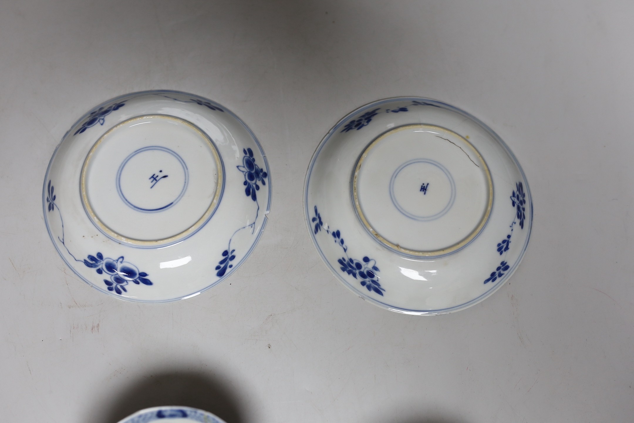 A Chinese blue and white landscape dish, Qianlong period 31cm diameter, together with a similar pair of tea bowls and saucers